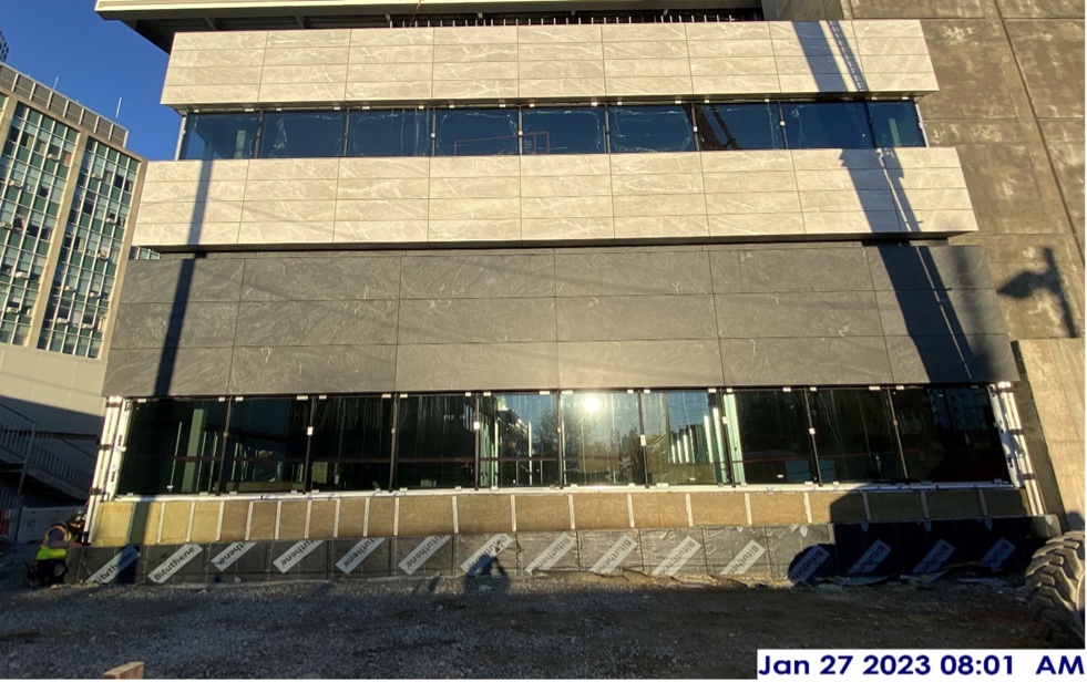 Installation of stone and glass façade near Oakland Avenue.